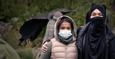 a couple wearing masks